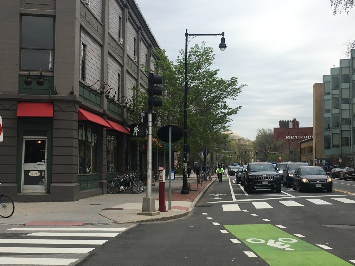 The Massachusetts Avenue protected bike lane near Front Street and the Cambridge Bicycle shop, pictured in May 2019.