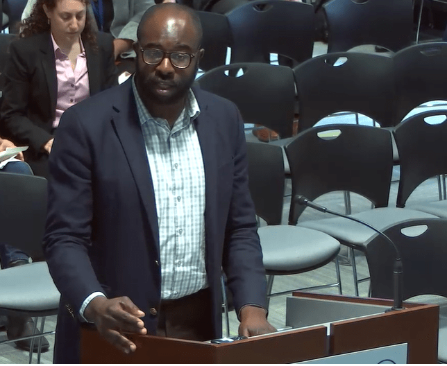 Jarred Johnson, COO of TransitMatters, testifies in support of MBTA late-night bus service at thee T's Fiscal and Management Control Board Heading on May 13, 2019. Courtesy of the MBTA.