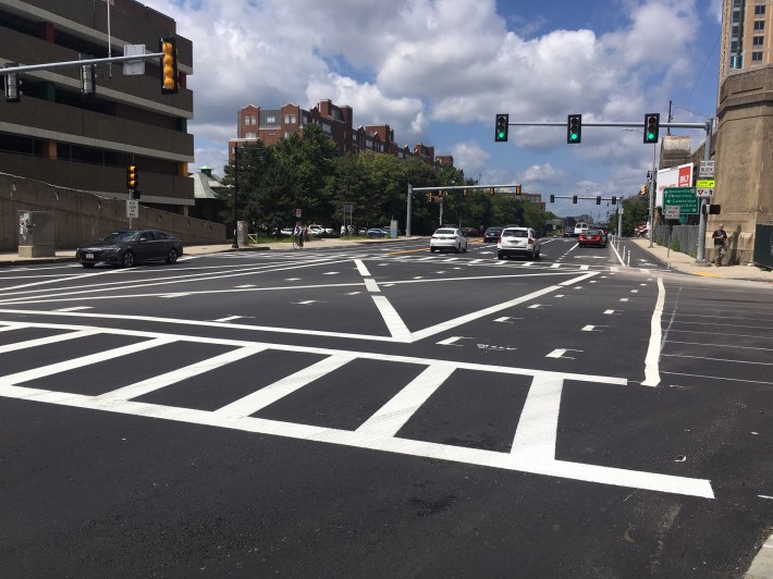 The new northbound bike lane, pictured here looking west from the corner of Museum Way on August 8, 2019, extends for one block on the O'Brien Highway in Cambridge before ending at Charlestown Avenue, where new bike-only traffic signals have been installed.