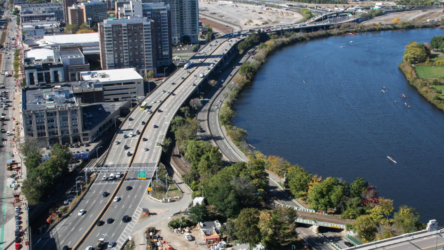 An aerial view of the "throat" section of Interstate 90 near Boston University, looking west toward the vacant former railyards where Harvard University aims to develop a new urban neighborhood of housing, office and lab space. Courtesy of MassDOT.