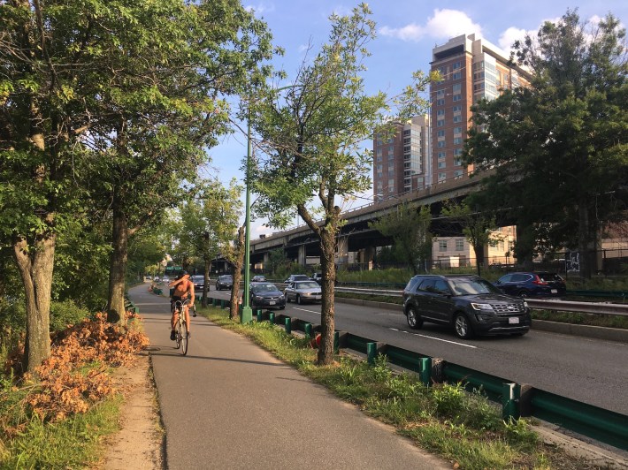 A bicyclist rides along the Paul Dudley White Path along Soldiers Field Road, just west of the Boston University Bridge, on Sept. 11, 2019.
