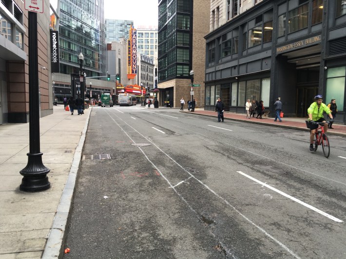 Spray painted lane markings indicate the future locations of a new protected bike lane on Washington Street approaching Downtown Crossing in this photo from Wednesday, Oct. 29, 2019. A dedicated bus lane for the Silver Line is expected to go in on the opposite side of the street.