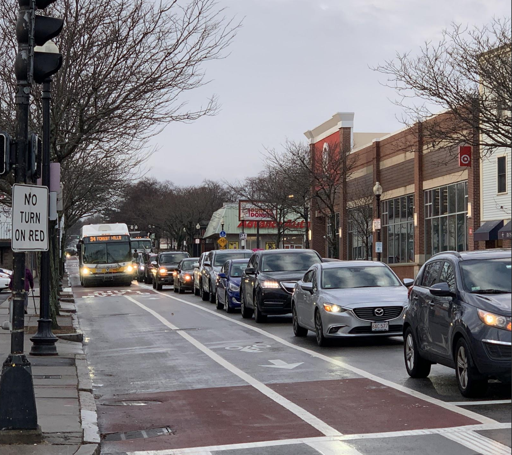 A Forest Hills-bound bus bypasses morning traffic on Washington Street in Roslindale. Photo courtesy of the City of Boston.