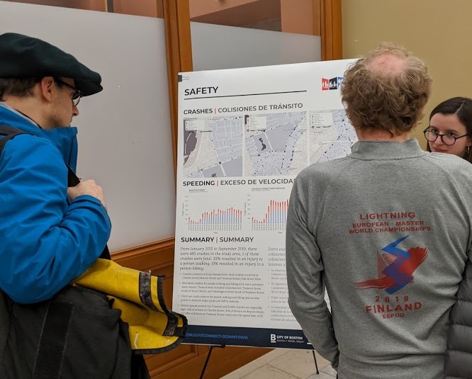 Residents discuss crash data from downtown streets with city planners at an open house for the city's "Connect Downtown" project, which aims to provide better connections across downtown Boston and the Boston Common for bike users and pedestrians. Photo by Elena Huisman.