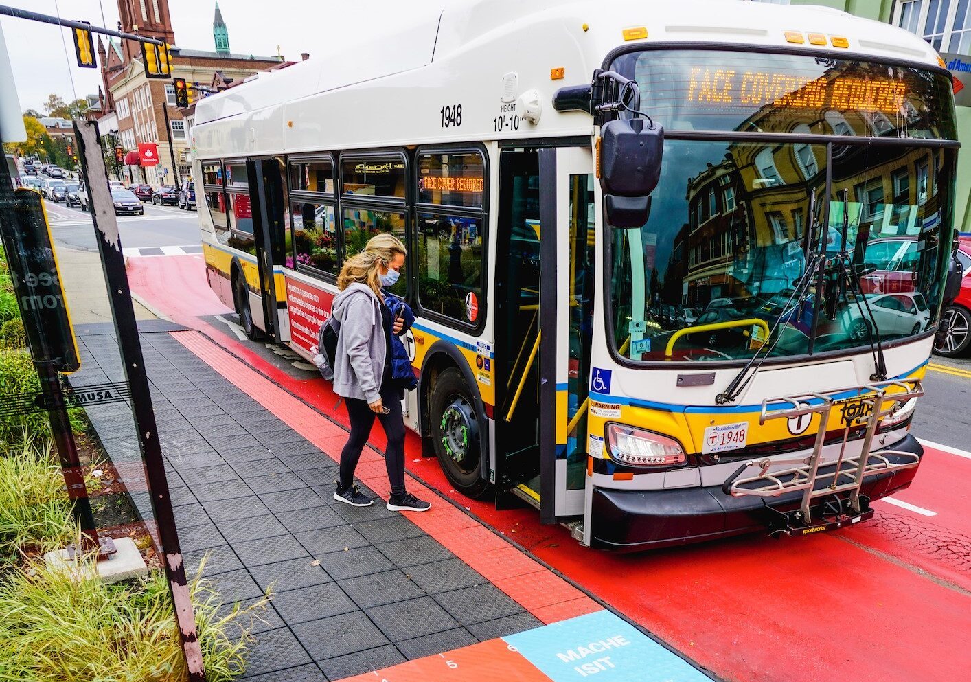 A rider boards an MBTA bus on Broadway in Everett.