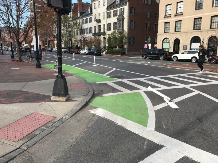 As seen in this photo, taken on November 17, A driver had already run over one of the project's new flexposts at the corner of Charles and Beacon St., at the northeast corner of the Public Garden, just days after installation.