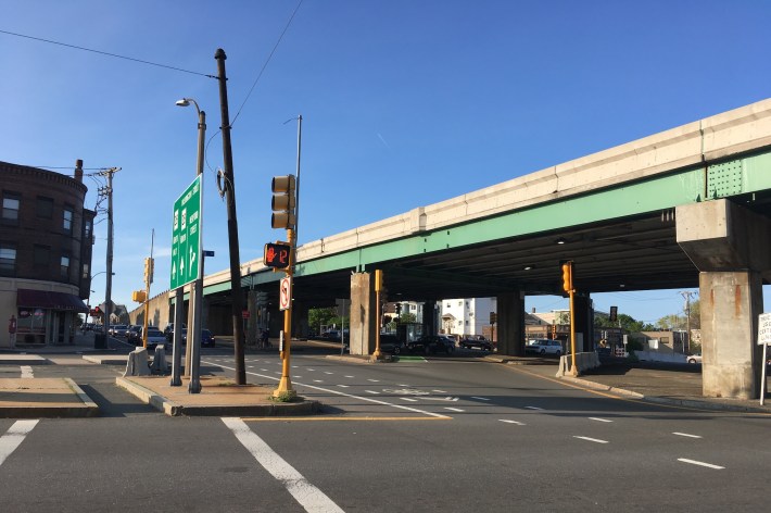 The McGrath Highway overpass above Washington Street near Somerville's Union Square, pictured in May 2019. The City of Somerville has embraced a plan to tear down the highway's overpasses, which divide East Somerville neighborhoods and threaten residents with elevated levels of traffic violence and air pollution.