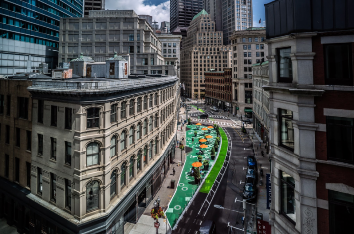 The Tontine Crescent plaza was originally installed with temporary materials in 2018. The green areas in this photograph are painted asphalt in the former Franklin Street roadway. Courtesy of Millennium Partners and the City of Boston.