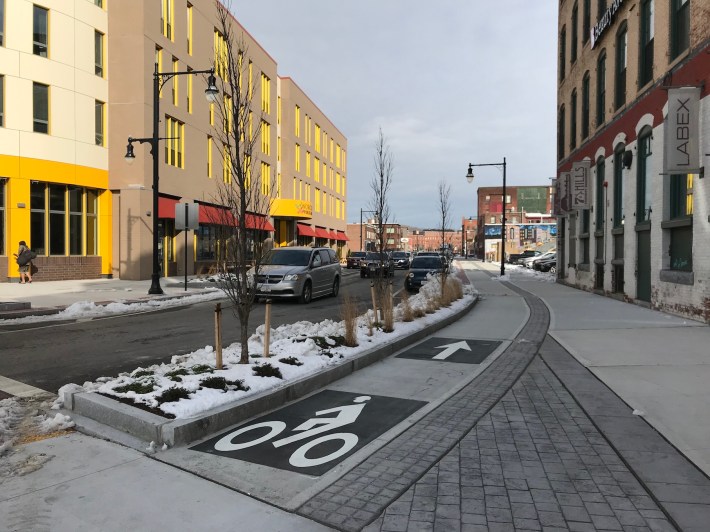 The Kelley Square reconstruction project added new bike infrastructure to several Canal District streets, including this sidewalk-level protected bike lane on Harding Street, pictured in December 2020.