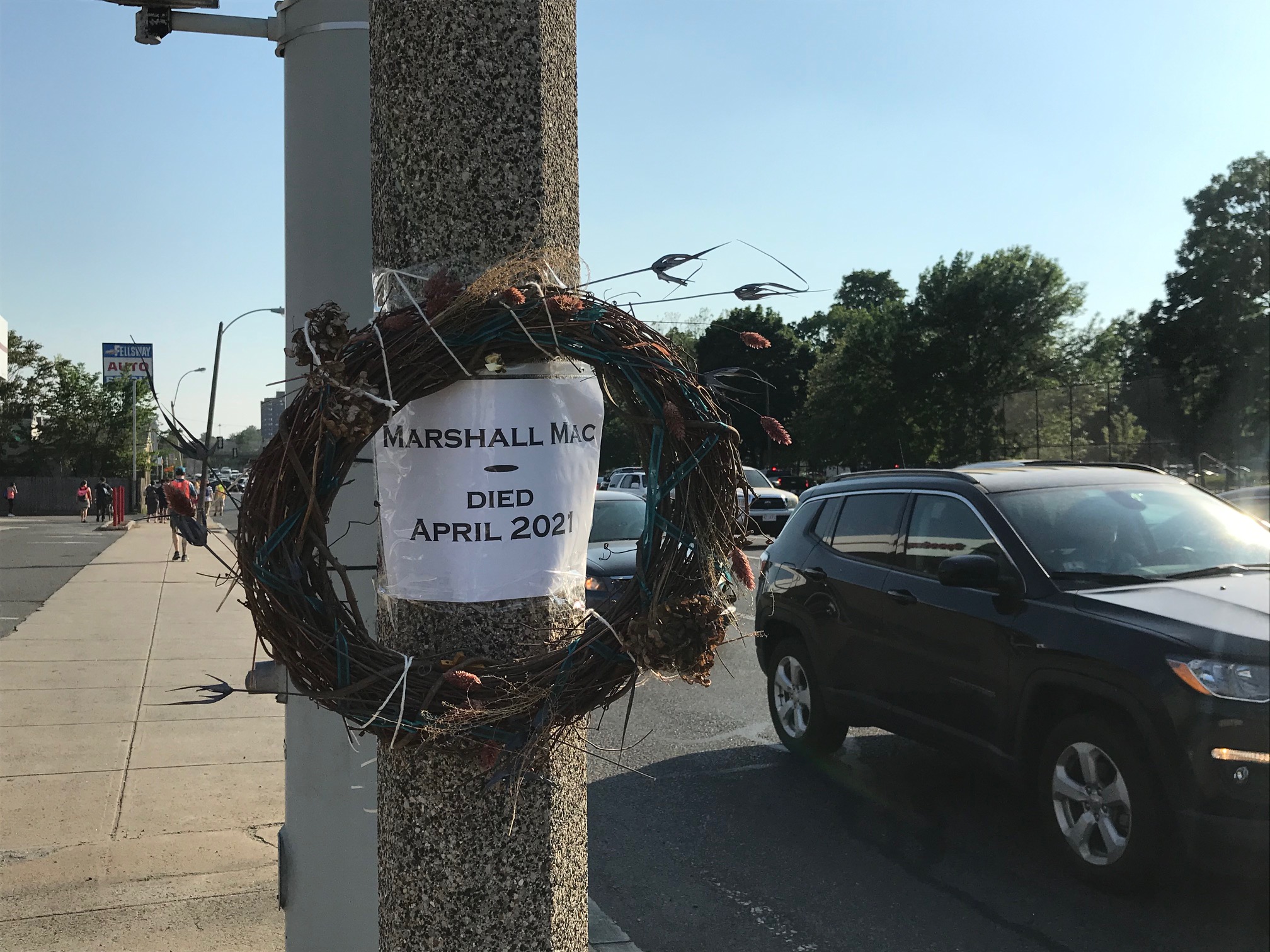 A makeshift memorial to Marshall Mac, a 72-year-old Vietnam War veteran, who died after a hit-and-run driver struck him on McGrath Highway near Foss Park in Somerville.