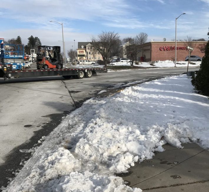 The intersection of West Boylston Street (at left) and Woodbury St. (right) is currently designed to let cars merge without stopping. In spite of its location next to the neighborhood CVS drug store and Shaw's Supermarket, there is no crosswalk for pedestrians.