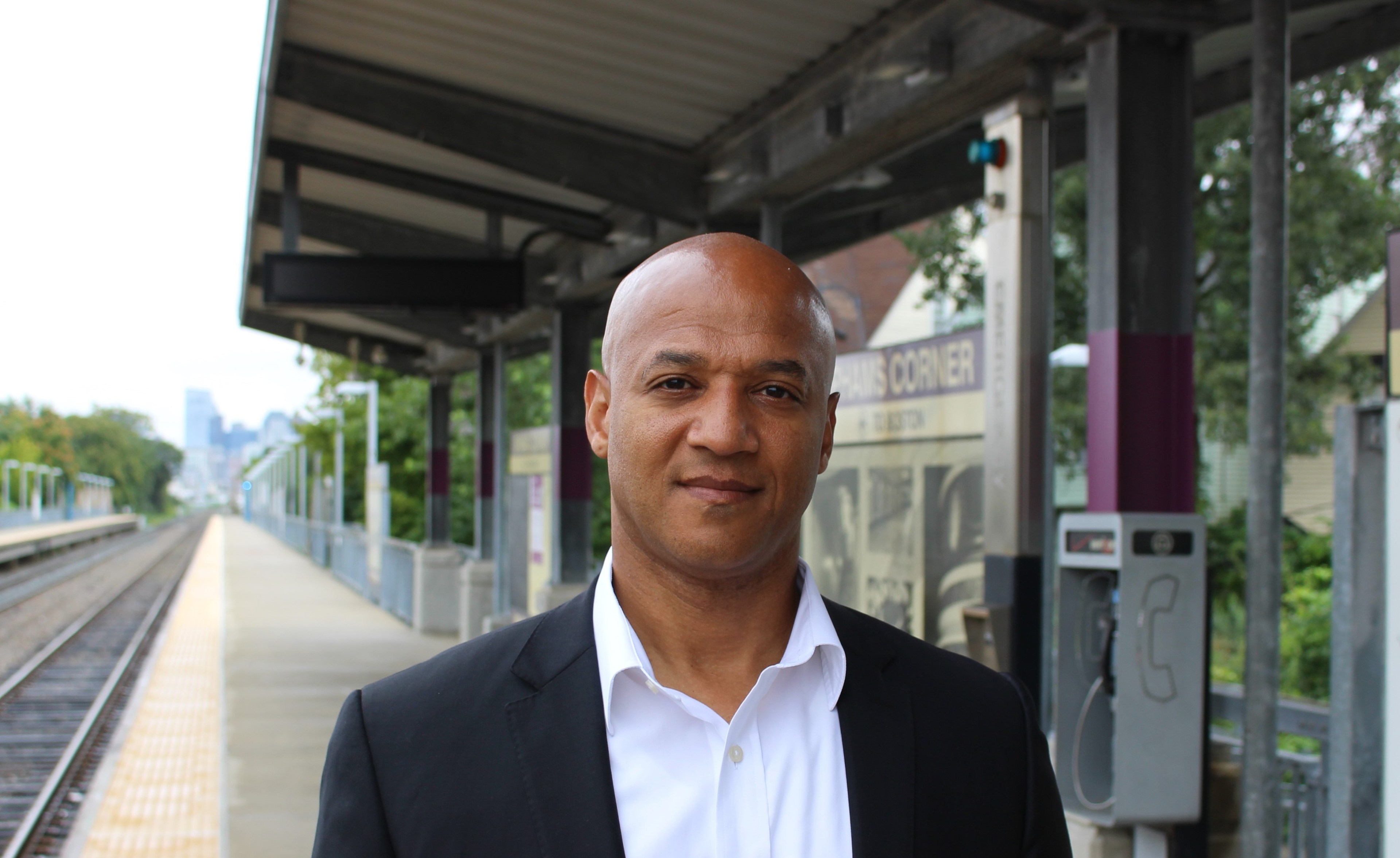 John Barros, candidate running to be Boston's next mayor, on the train platform at the Upham's Corner station.