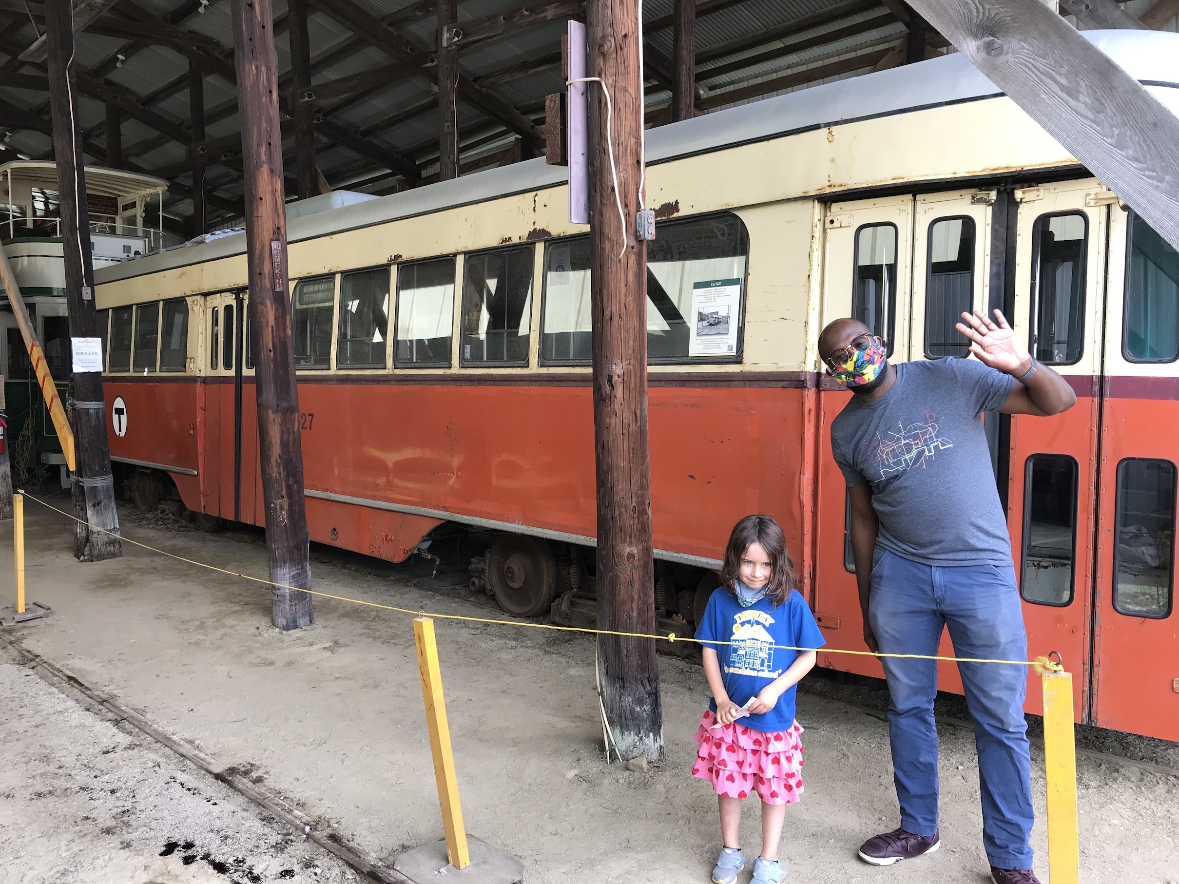 TransitMatters executive director Jarred Johnson, with the author's nonplussed 6 year-old, wave in front of Car 3127, a 1946 Pullman streetcar