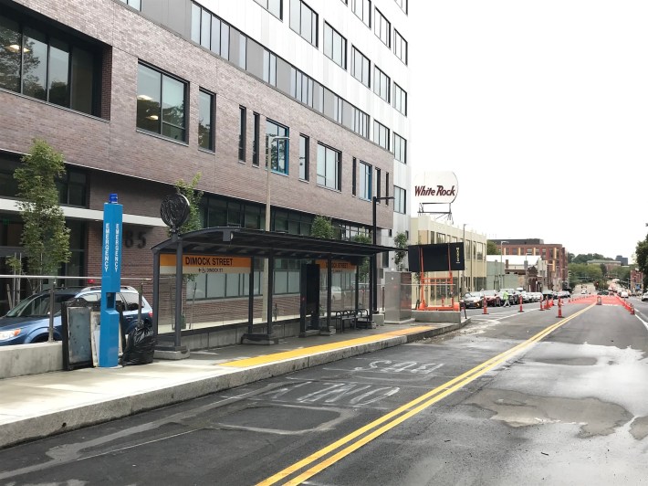 The new "gold standard" bus stop at Dimock Street in the Columbus Avenue busway includes fare vending machines (not yet installed), real-time information displays, and near-level boarding platforms.