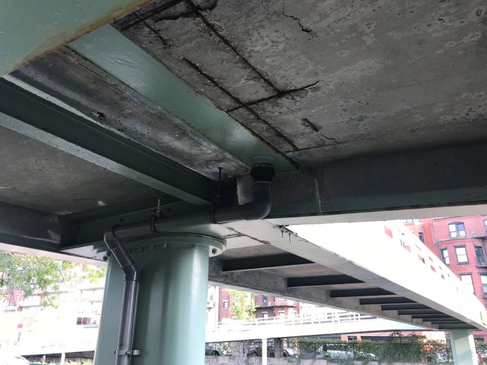 Underside of Fairfield St. overpass over Storrow Drive, showing concrete spalling.