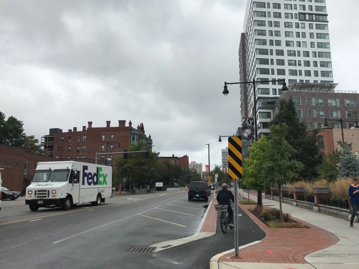 A new physically-separated bike lane on Massachusetts Avenue at Lafayette Square, near the intersection of Sidney Street.