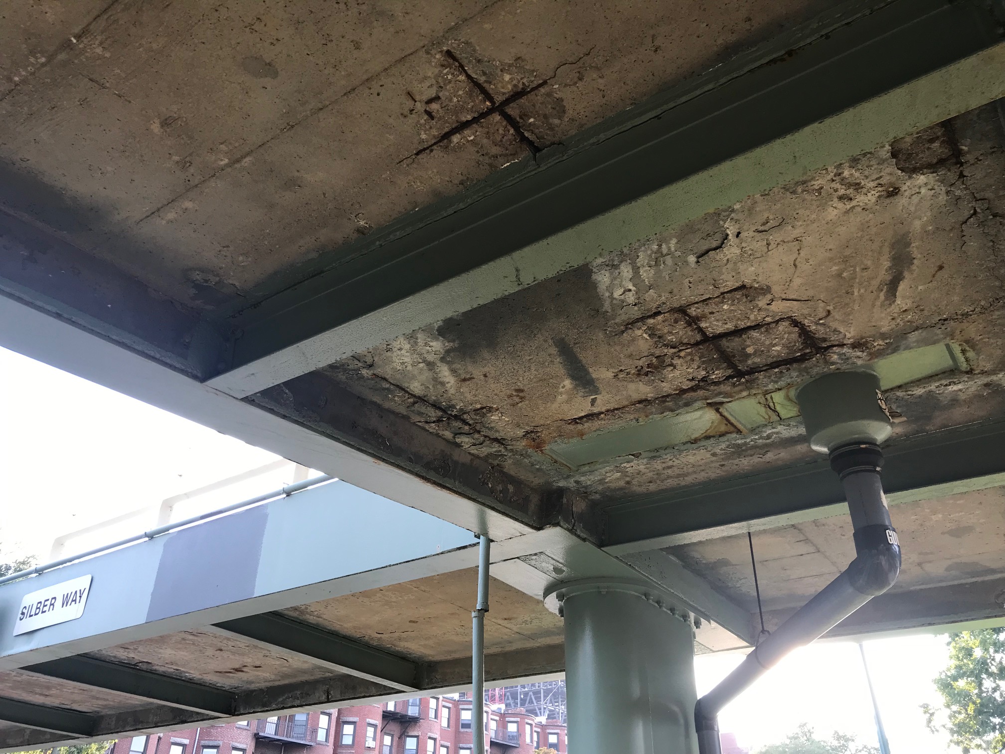Deterioration of the concrete deck on DCR's Sibler Street pedestrian overpass over Storrow Drive.