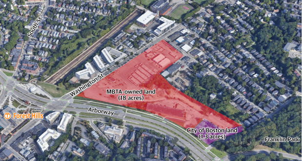 An aerial view of the neighborhood east of the Forest Hills subway station in Jamaica Plain highlighting the MBTA-owned land along the Arborway and Washington Street where the T plans to build a new bus garage. The site is highlighted in red and is shaped like a backwards seven in the middle of the image.