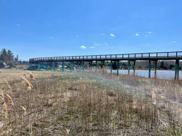 The new Mattaposett Rail Trail boardwalk over marsh grasses on the Mattapoisett waterfront.