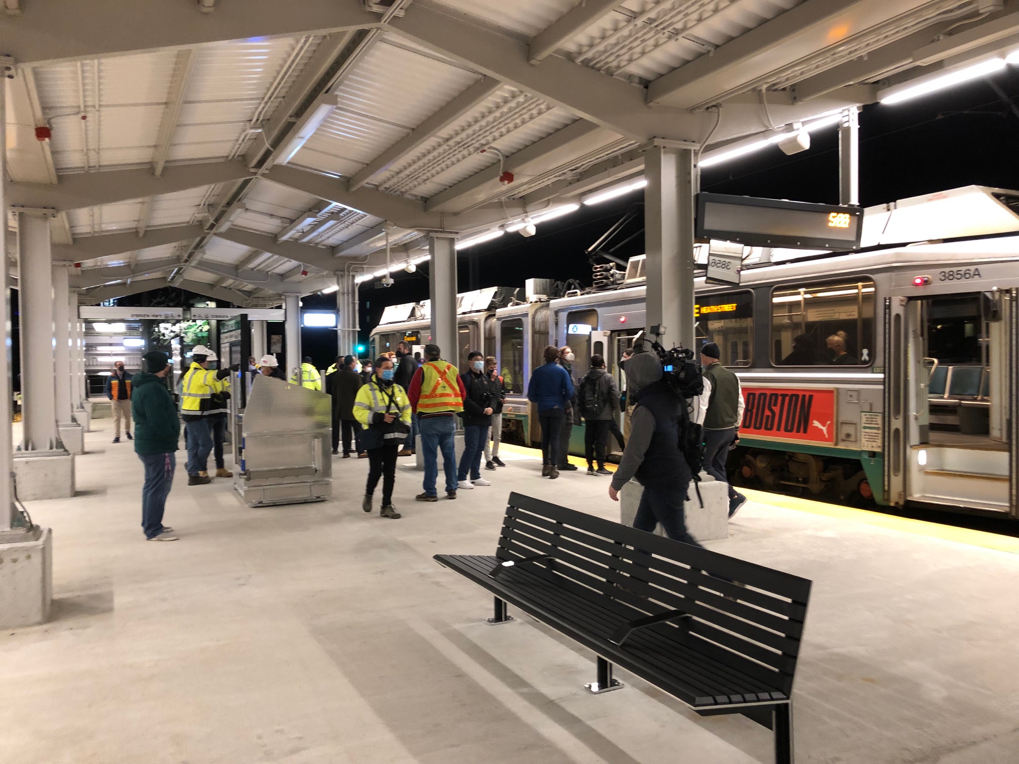 Passengers on the new Lechmere station platform next to the first train on the new Green Line extension at 5 a.m. on Monday, March 21, 2022.
