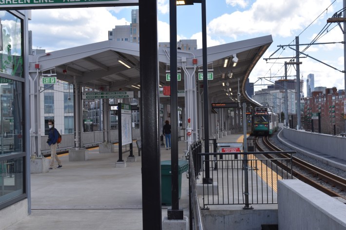 A Boston-bound train arrives at the platform of the new Lechmere Green Line station, located on an elevated viaduct next to the O'Brien Highway in Cambridge.