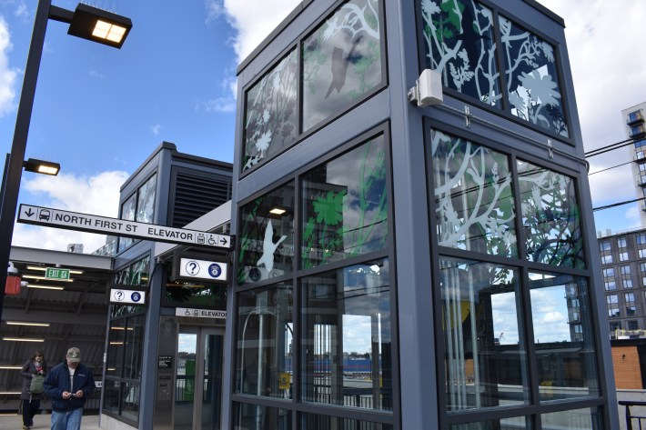 Randal Thurston's artwork adorns the glass elevator towers at Lechmere Station. The piece "features "the flora and fauna found in North Point Park throughout the year," according to the artist's statement.