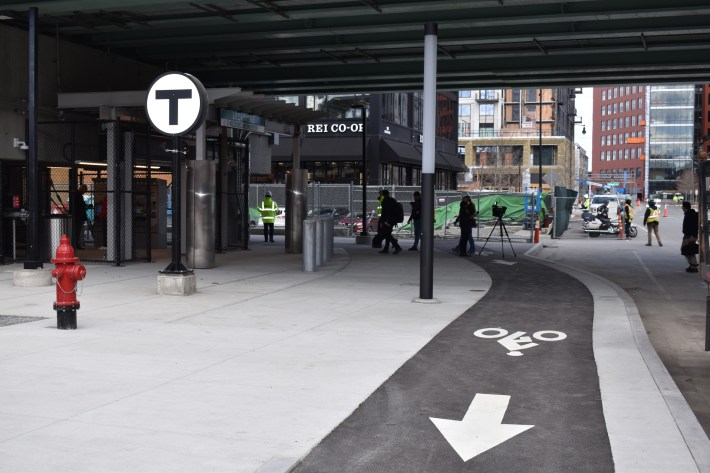 The First Street entrance to the new Lechmere station, looking north into the Cambridge Crossing development. Street reconstruction projects still in progress for the area will add a network of physically protected bike lanes on First Street and the O'Brien Highway.