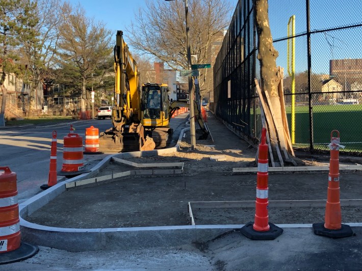 New sidewalks under construction on Ruggles Street next to the Madison Park High School playing fields.