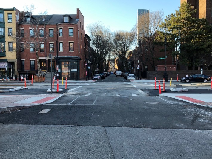 A new raised crosswalk under construction across West Springfield Street at its intersection with Tremont Street in Boston's South End.