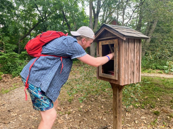 A cute wooden Little Free Library at the entrance of Nira Rock Urban Wild.
