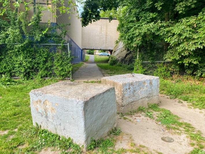 walkway tucked in between two buildings on the north side of Jefferson Playground in Jamaica Plain.