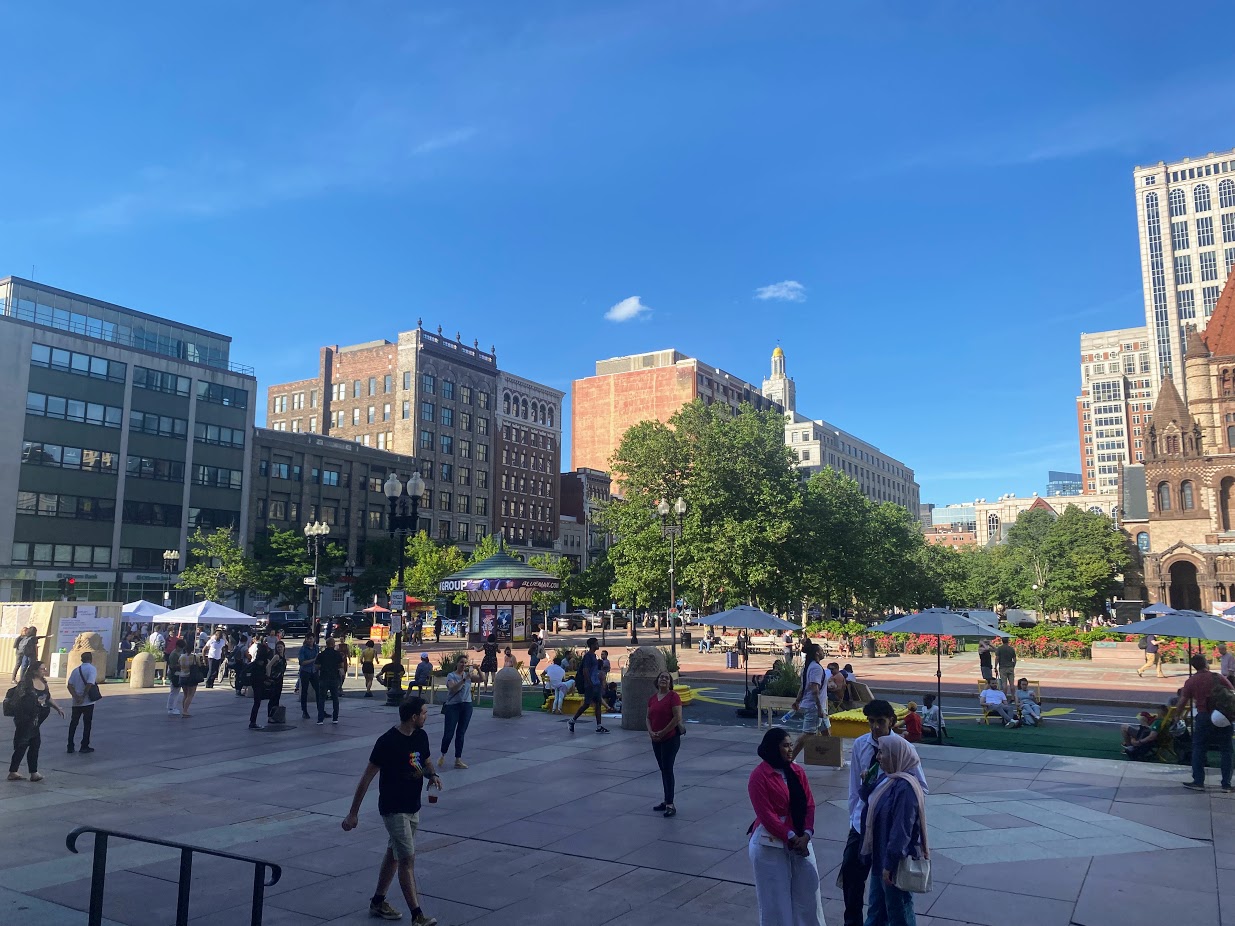 A view from the Boston Public Library steps overlooking the festivities from day one of Copley Connect, a pilot project that will close one block of Dartmouth Street to motor vehicle traffic in order to expand the public space of Copley Square.