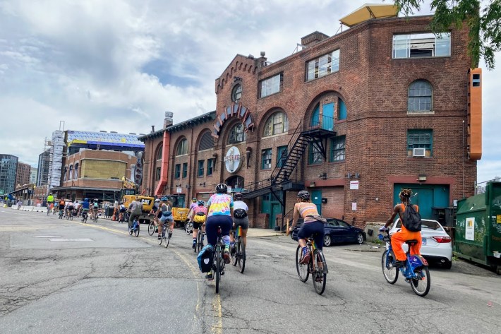 bicyclists Riding Ipswich Street into Lansdowne Street for Bar Fest.