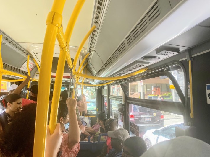 Crowded shuttle bus stuck in mixed traffic on its way from North Station to Government Center.