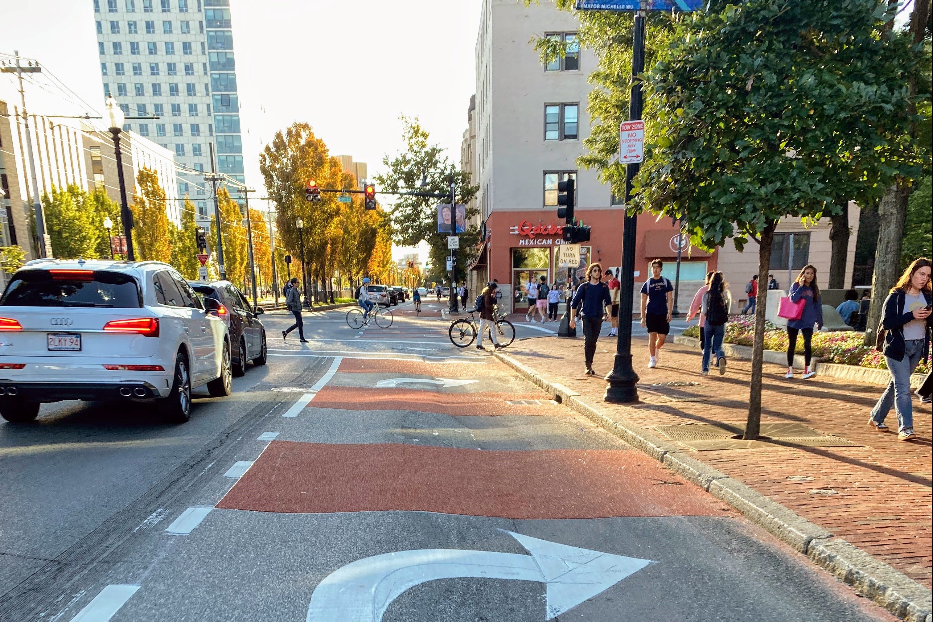 red paint and white arrows along the new bus and bike lane