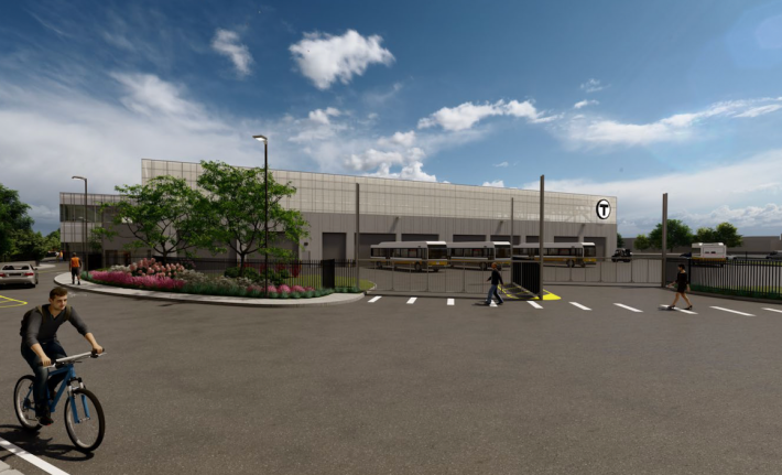 A rendering of a new bus garage, showing a gray, low-slung building with eight garage doors facing the viewer, and three black-and-yellow MBTA buses parked in the lot in front. In the foreground, a bike rider and two pedestrians walk along the garage driveway. The MBTA's "T" logo is visible on the top of the building.