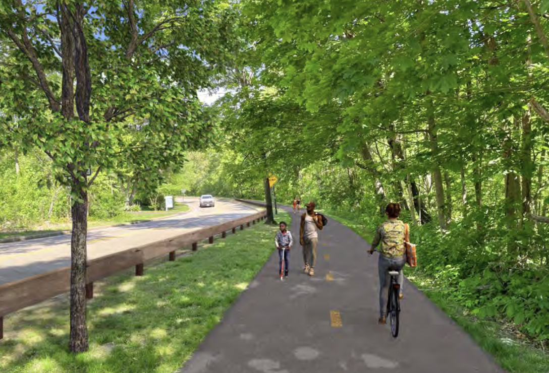 A photo illustration of a proposed new shared-use path. A wide, paved path runs through the middle of the image and is lined on both sides by trees and shade. To the left is a wooden guardrail and a two-lane roadway.