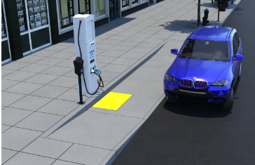 a blue electric car parked on the curb next to a ramp leading to a charging station.