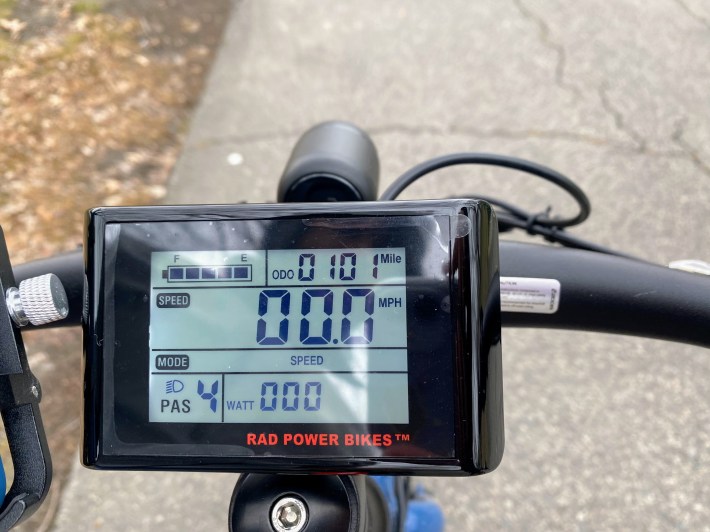 the digital display on the e-bike's handlebars signals 101 miles on the odometer.