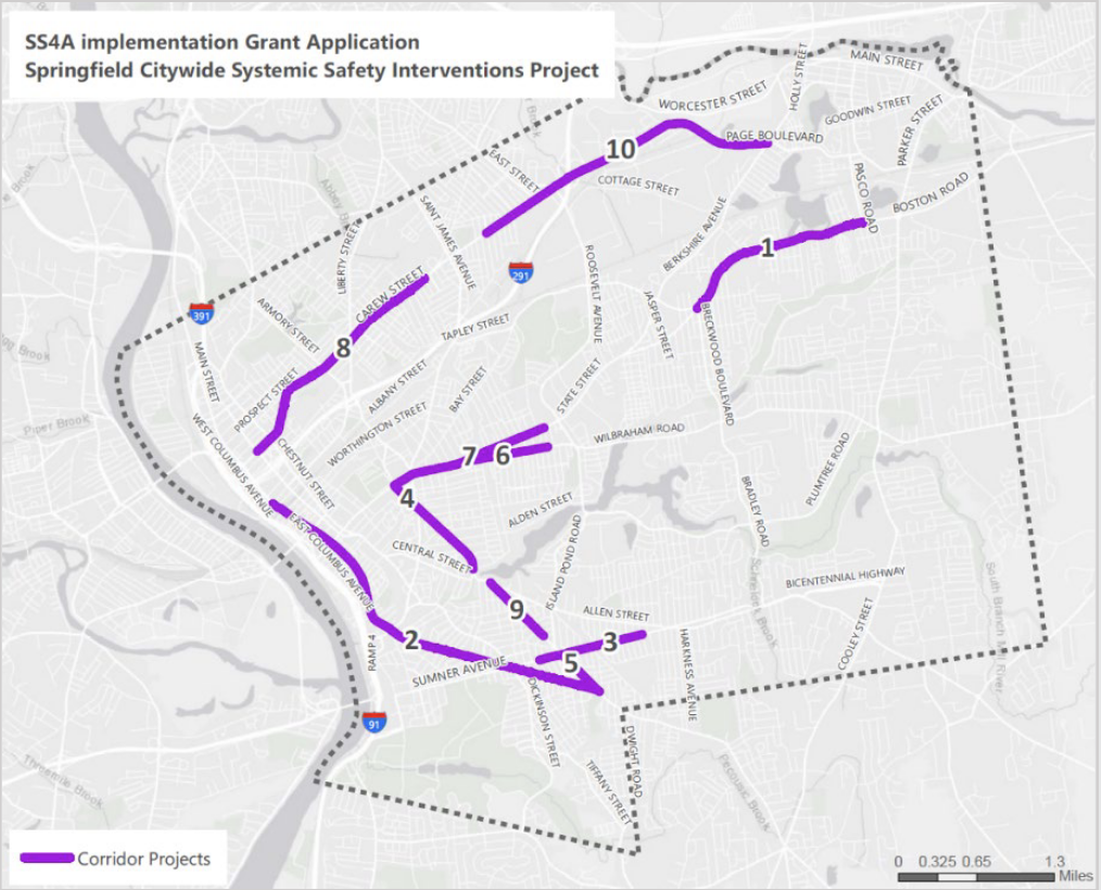 A map of Springfield highlights 10 corridors, in purple, that will be targeted for safety improvements in the USDOT's Safe Streets for All project. Highlighted Streets include State Street east of the Armory, Wilbraham Road between State and Wesson Park, Walnut Street, several streets around "The X" including Belmont Ave. and Sumner Ave., Main St., downtown, Carew St., Page Blvd., and Boston Rd.