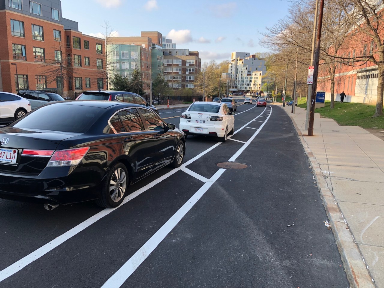 The new parking-protected bike lane on South Huntington Avenue, looking north towards Heath Street.