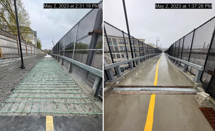 A pair of photographs show unfininshed segments of a bike path under construction. The left photo shows the asphalt path interrupted by an unpaved segment that's covered in a grid of green steel rebar, with a guardrail and chain-link fence on the right and a wooden stockade fence and streetlamps to the left. The right photo shows a section of trail on a bridge with a large gap in the paving at a bridge joint. Both sides of the trail are lined by guardrails and tall fencing and a multi-story building in the near background suggests that the bridge is several stories above the ground. Both photos are timestamped from May 2, 2023.