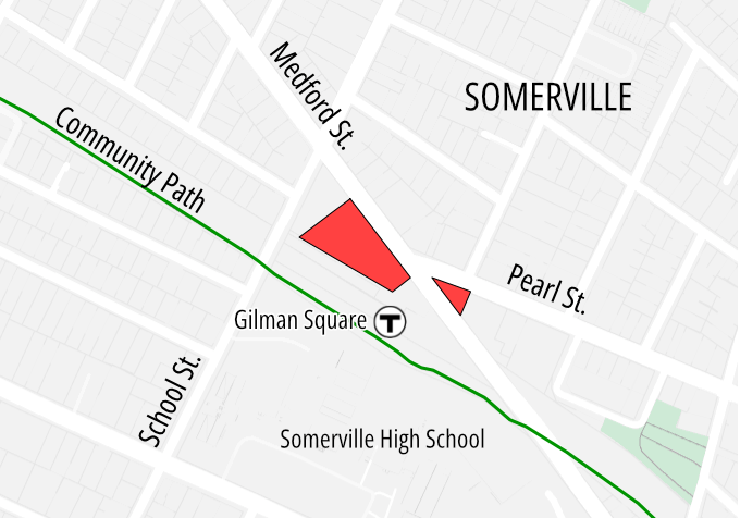 Map of the Gilman Square station area in Somerville highlighting two city-owned plots of land. The larger plot is a trapezoid-shaped parcel between the Gilman Sq. T stop and Medford Street, which runs diagonally across the map from upper left to lower right. The second parcel is a smaller triangle at the corner of Medford and Pearl, just east of (right of) the other parcel