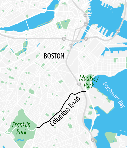 Map of Boston highlighting the location of Columbia Road, which runs in a NE-SW direction from Moakley Park on the shore of Dorchester Bay to Franklin Park in the lower left corner of the map.