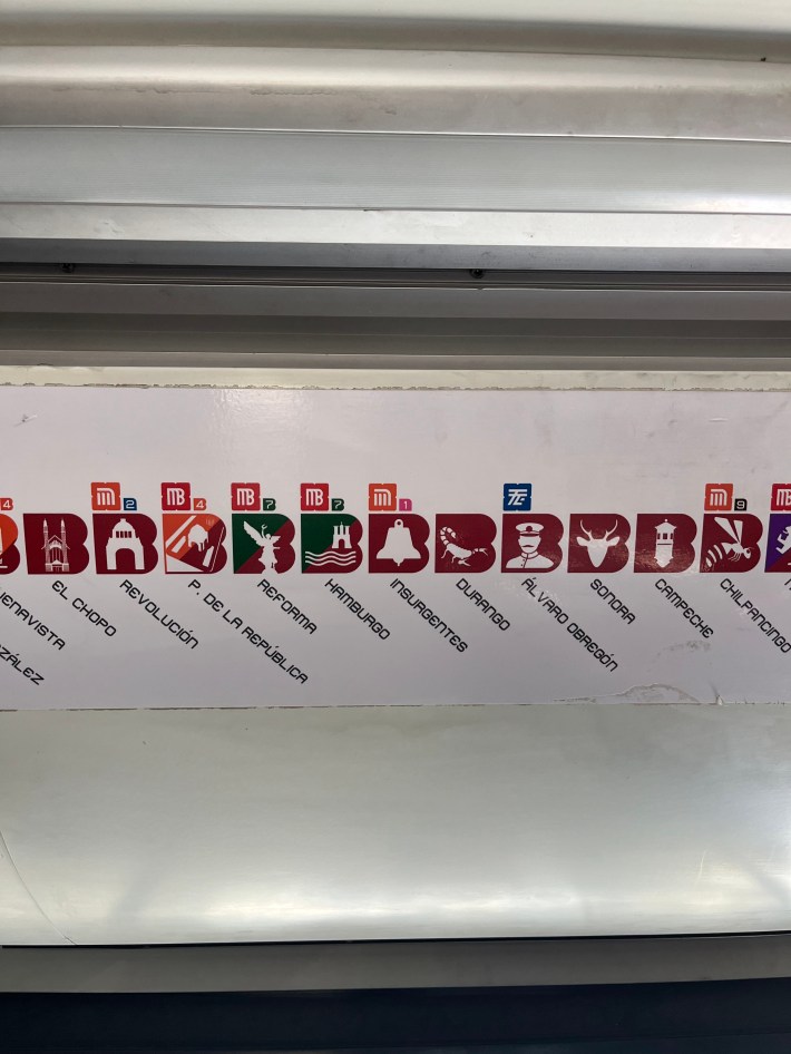 A row of pictograms denote different stations on the Mexico City metro system