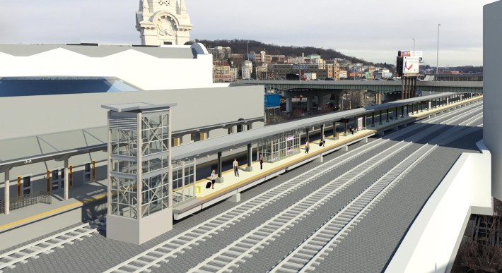 A rendering of a new train platform in front of the Worcester skyline next to the historic Worcester Union Station (at left).